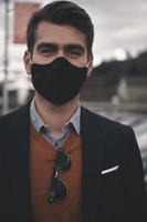 business man wearing protective face mask at luxury office photo