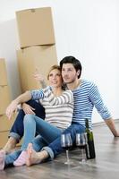 Young couple moving in new house photo