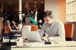 startup business, software developer working on computer photo
