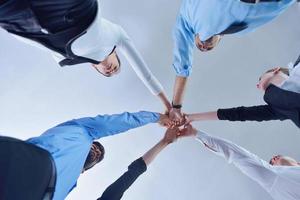 business people group joining hands photo