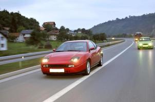 Tuning cars sacing down the highway photo