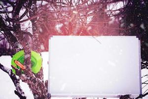 whiteboard on winter tree photo