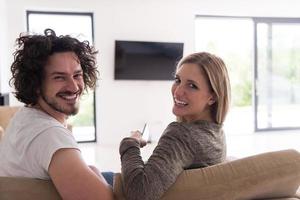 Rear view of couple watching television photo