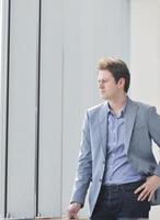 young business man alone in conference room photo