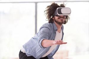 man using VR-headset glasses of virtual reality photo