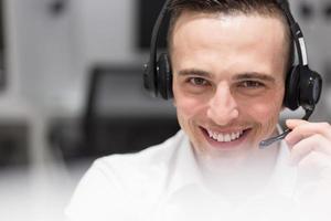 male call centre operator doing his job photo