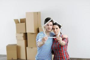 Young couple moving in new house photo