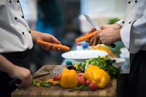 chefs hands cutting carrots photo