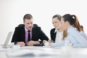 Group of young business people at meeting photo