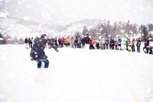 group of young people having a running in bag competition photo