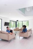 multiethnic couple in living room photo