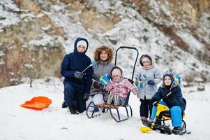 Scandinavian family with Sweden flag in winter swedish landscape. photo
