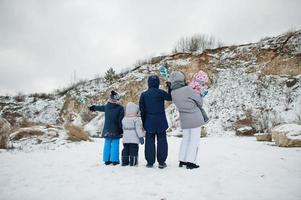 Back of scandinavian family with Sweden flag in winter swedish landscape. photo