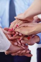 business people group joining hands photo