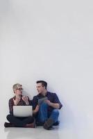 startup business, couple working on laptop computer at office photo