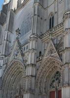 Gothic arches and ornaments. Facade of Nantes cathedral. photo