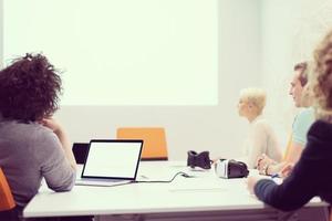 Startup Business Team At A Meeting at modern night office building photo