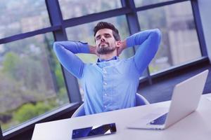 happy young business man at office photo