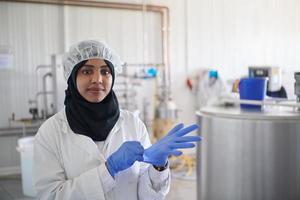 African black muslim business woman  in local  cheese production company photo