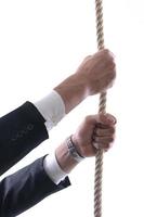 business man with rope isolated on white background photo