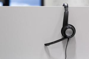 Headphones in empty call center office photo