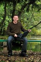 young businessman working on laptop outdoor photo