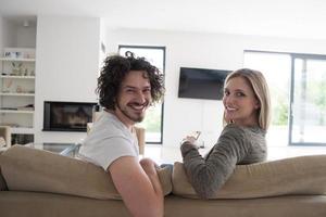 Rear view of couple watching television photo