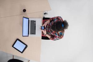 top view of young business woman working on laptop photo