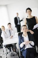 business woman with her staff in background photo