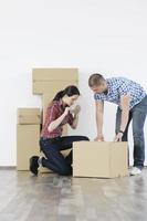 Young couple moving in new home photo