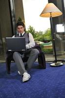 young businessman working on laptop photo