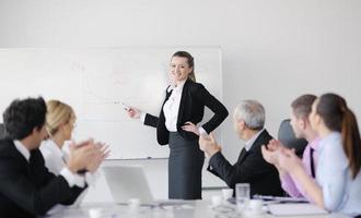 Group of young business people at meeting photo