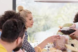 multiethnic group of happy friends lunch time photo