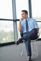 happy young business man at office photo