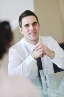 young business man alone in conference room photo