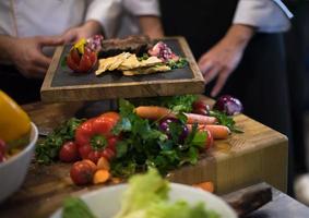 team cooks and chefs preparing meal photo