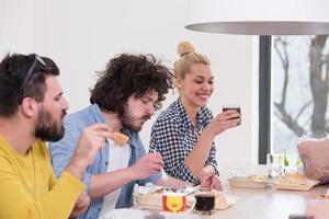 multiethnic group of happy friends lunch time photo