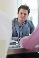 young business man alone in conference room photo