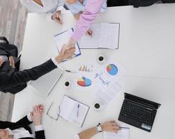 Group of young business people at meeting photo