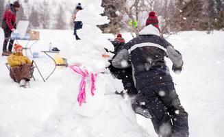 group of young people having fun in beautiful winter landscape photo