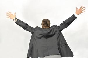 Outdoor portrait of young and happy  businessman photo