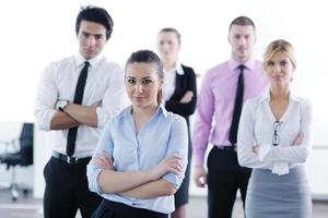 business woman standing with her staff in background photo