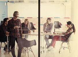 business woman at office speaking by phone  team on meeting in background photo