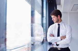 happy young business man at office photo