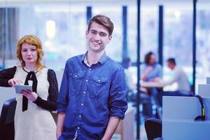 Business People Working With Tablet in startup office photo