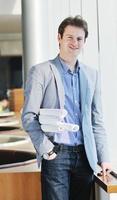 young business man alone in conference room photo