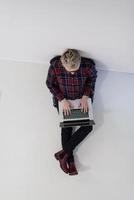 top view of young business woman working on laptop computer photo