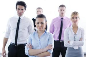 business woman standing with her staff in background photo