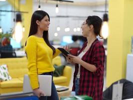 female friends discussion about project at moder coworking office photo