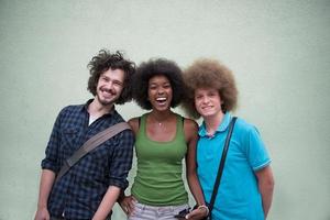 multiethnic group of happy three friends photo